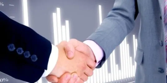 handshake isolated on business background. Handshake isolated on business background.