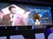 Palco de treinamento conduzido por Janderson Santos, com telão e iluminação